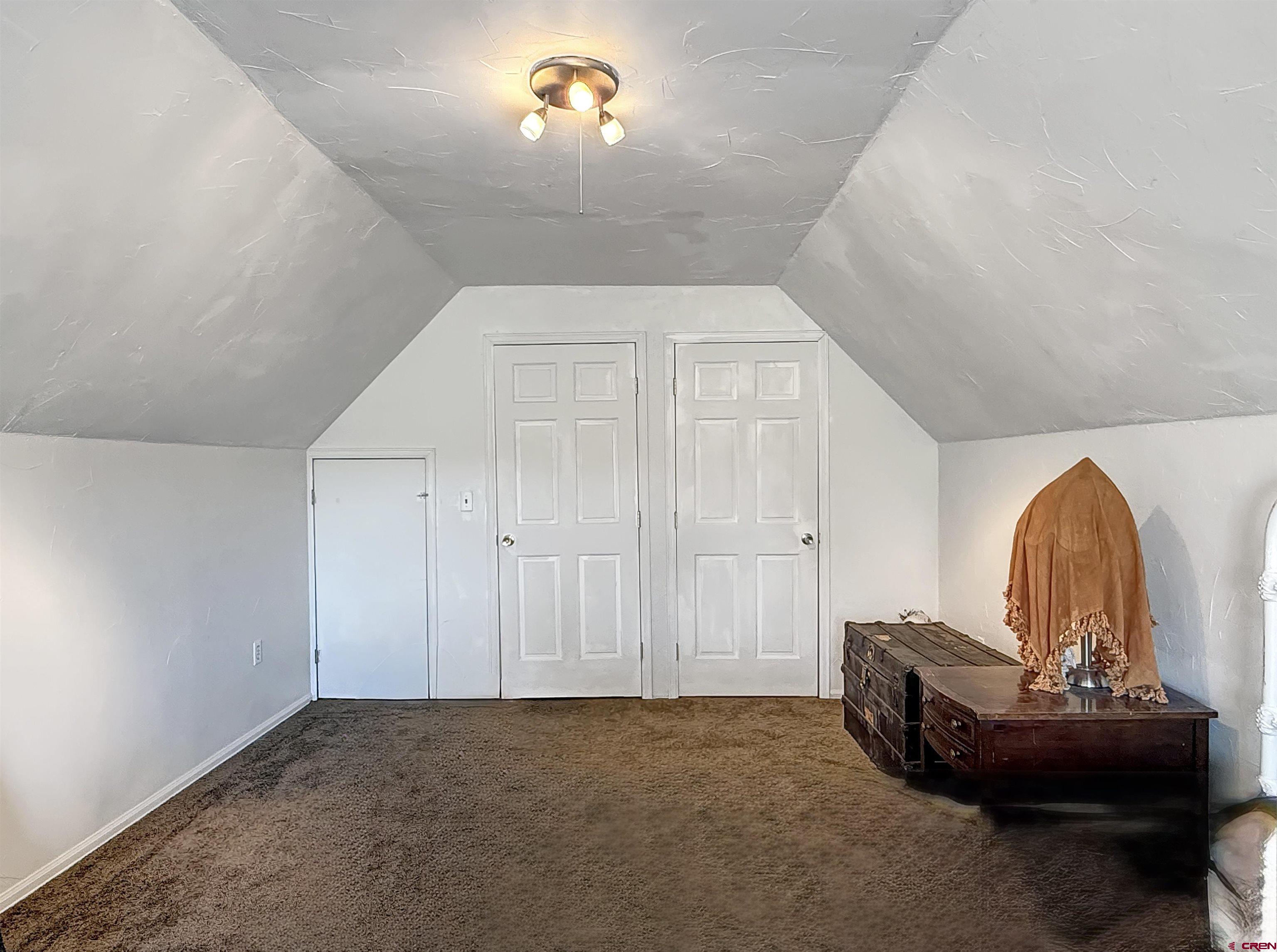 1174 3375th Road Crawford, CO 81415 - Photo 26 of 42 a living room with furniture and a fireplace