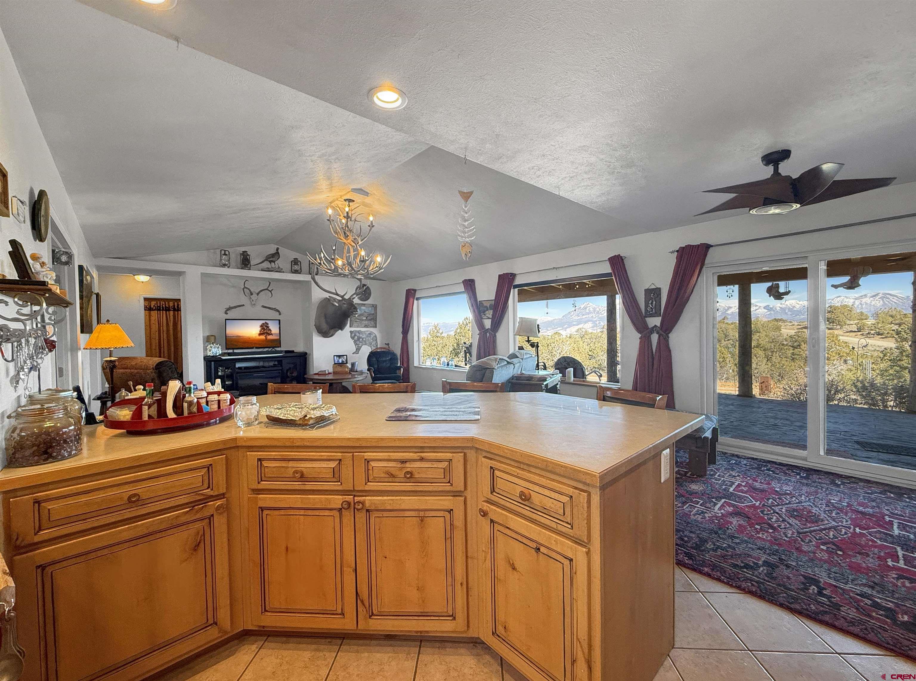 1174 3375th Road Crawford, CO 81415 - Photo 6 of 42 a kitchen with stainless steel appliances granite countertop a sink and cabinets