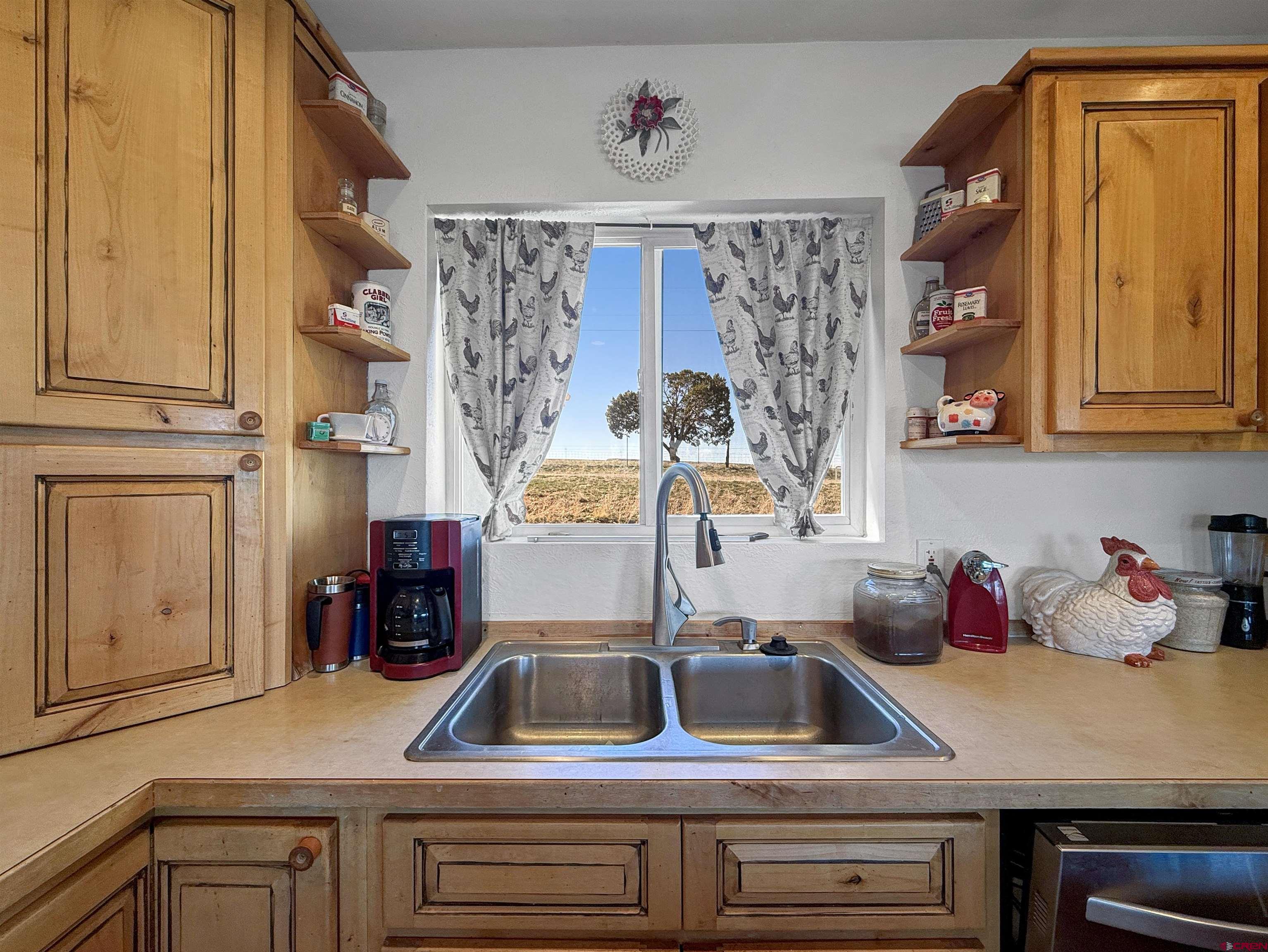 1174 3375th Road Crawford, CO 81415 - Photo 10 of 42 a kitchen with a sink and a window