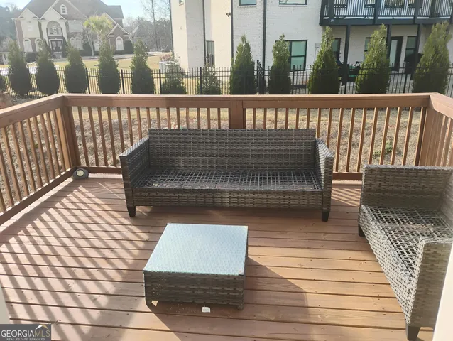 a view of a wooden deck with a bench