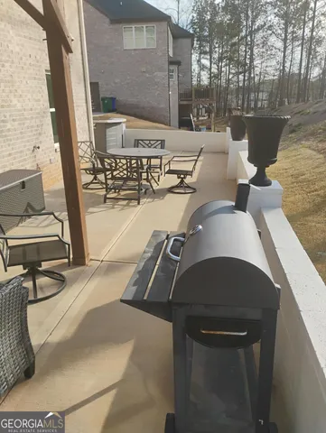 a view of living room with furniture and a rug
