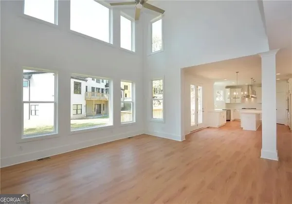 a view of staircase with white walls and windows