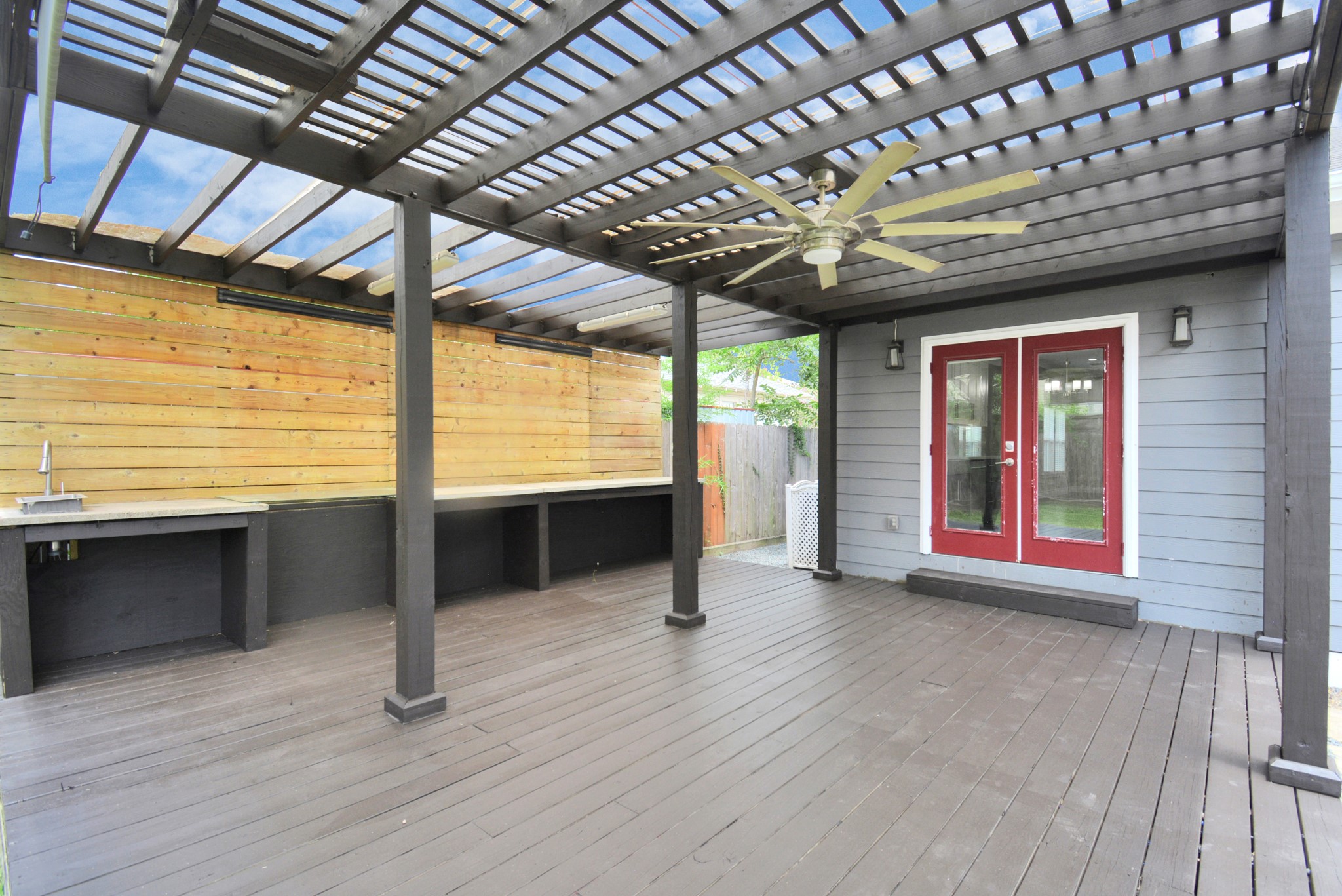 318 Ennis Street Houston, TX 77003 - Photo 23 of 28 Beautiful outdoor space with covered patio, sink and fan for all your outdoor entertainment!