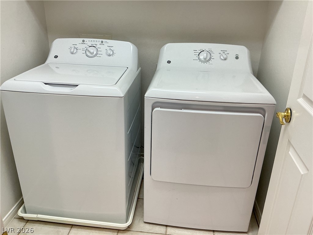 10975 Calcedonian Street Las Vegas, NV 89141 - Photo 11 of 25 This dedicated laundry area offers convenient home essential appliances.