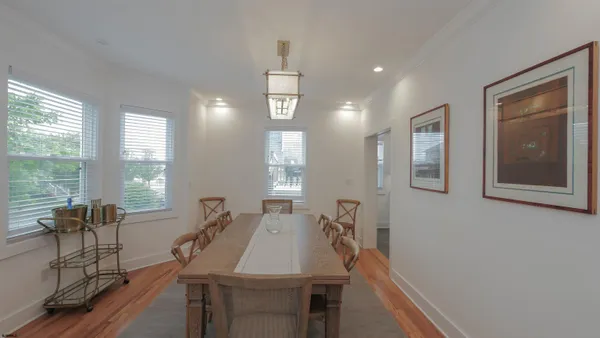 a view of a dining room with furniture window and outside view