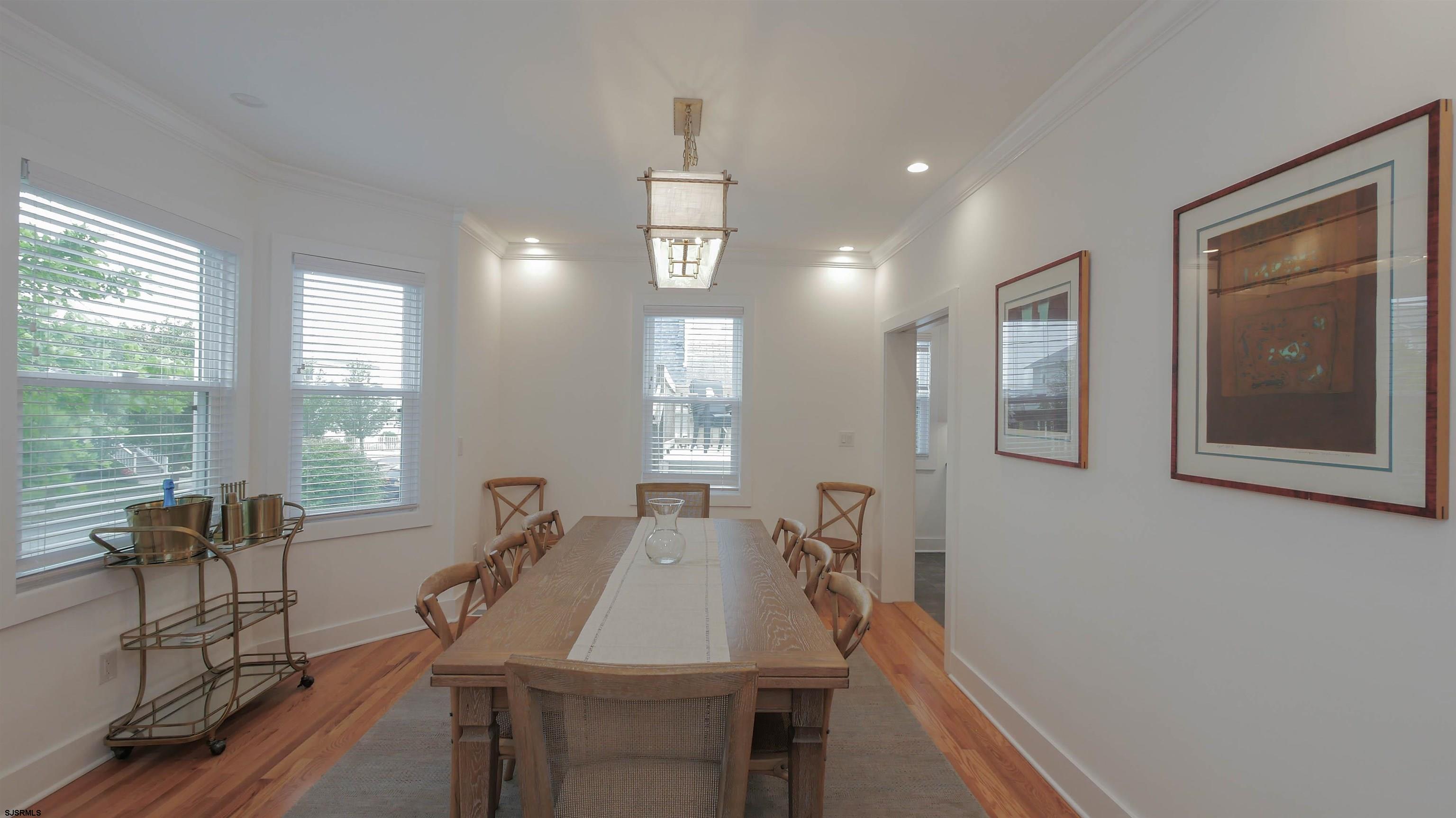 1 North Surrey Avenue, Unit CUSTOMIZE RENTAL Ventnor City, NJ 08406 - Photo 12 of 36 a view of a dining room with furniture window and outside view
