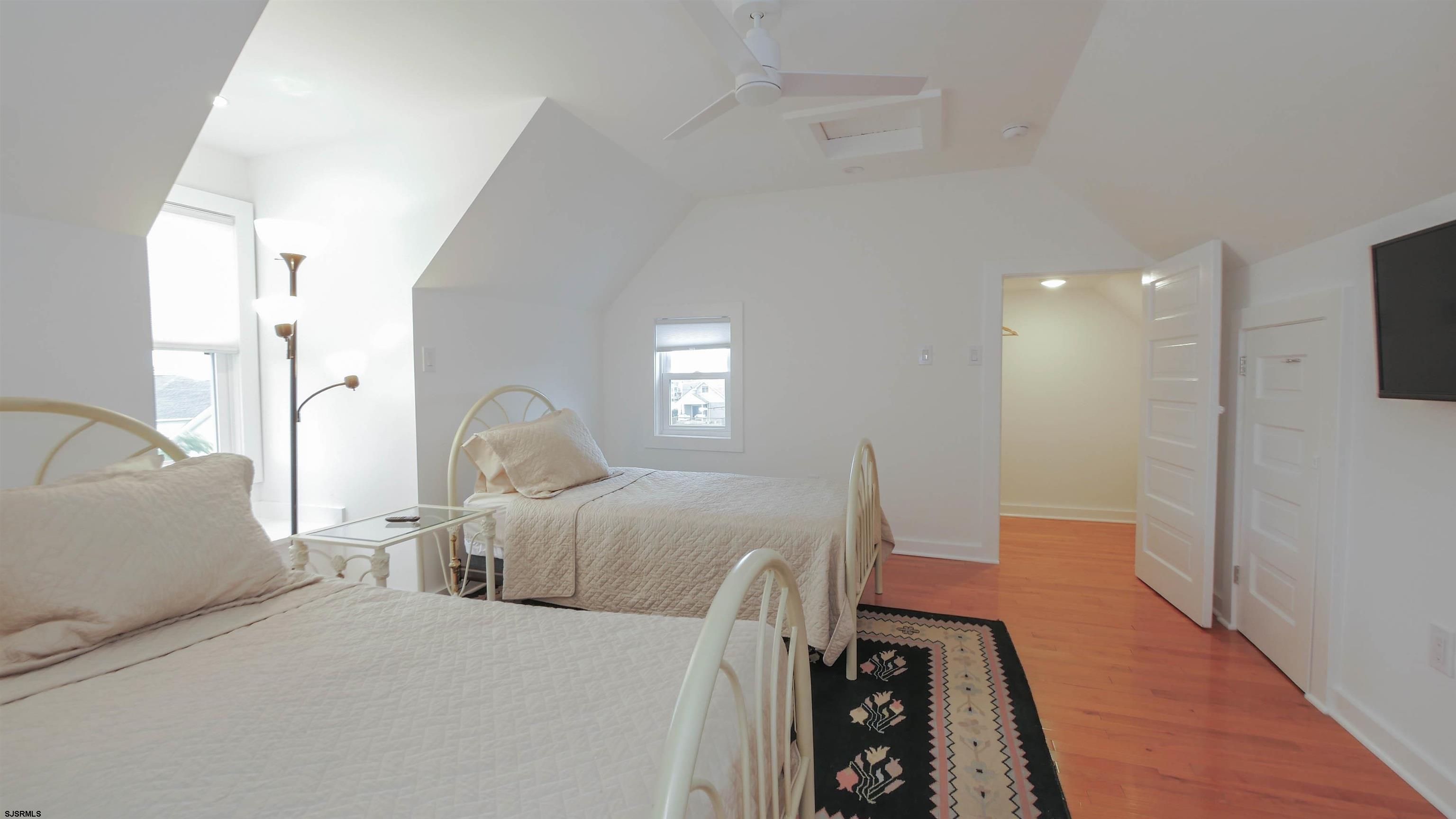 1 North Surrey Avenue, Unit CUSTOMIZE RENTAL Ventnor City, NJ 08406 - Photo 28 of 36 a bed room with a bed window and a television