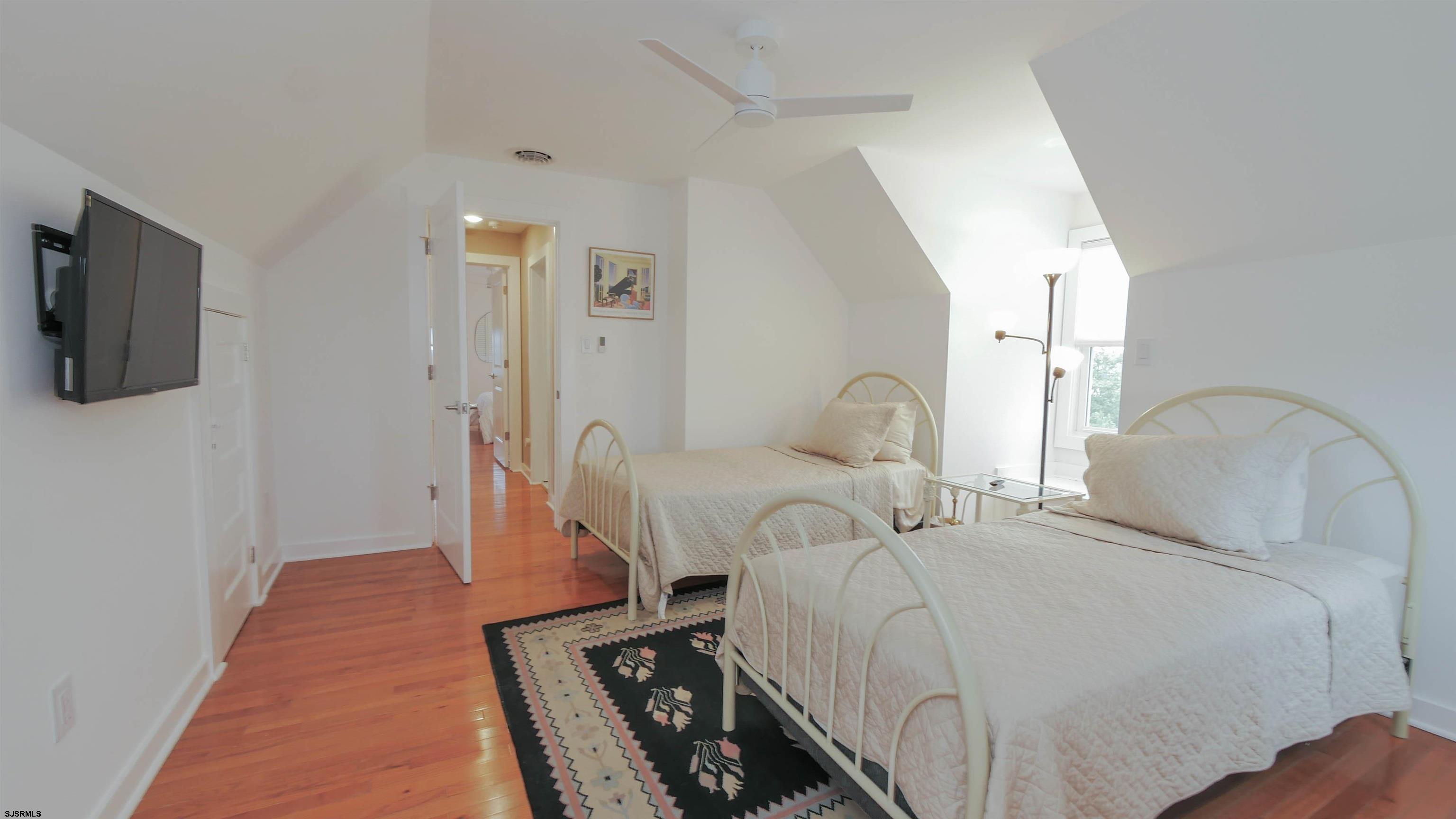 1 North Surrey Avenue, Unit CUSTOMIZE RENTAL Ventnor City, NJ 08406 - Photo 30 of 36 a bedroom with bed and a night stand