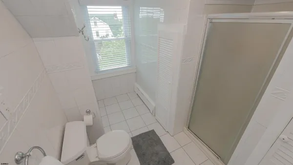 a room with a bed and a mirror