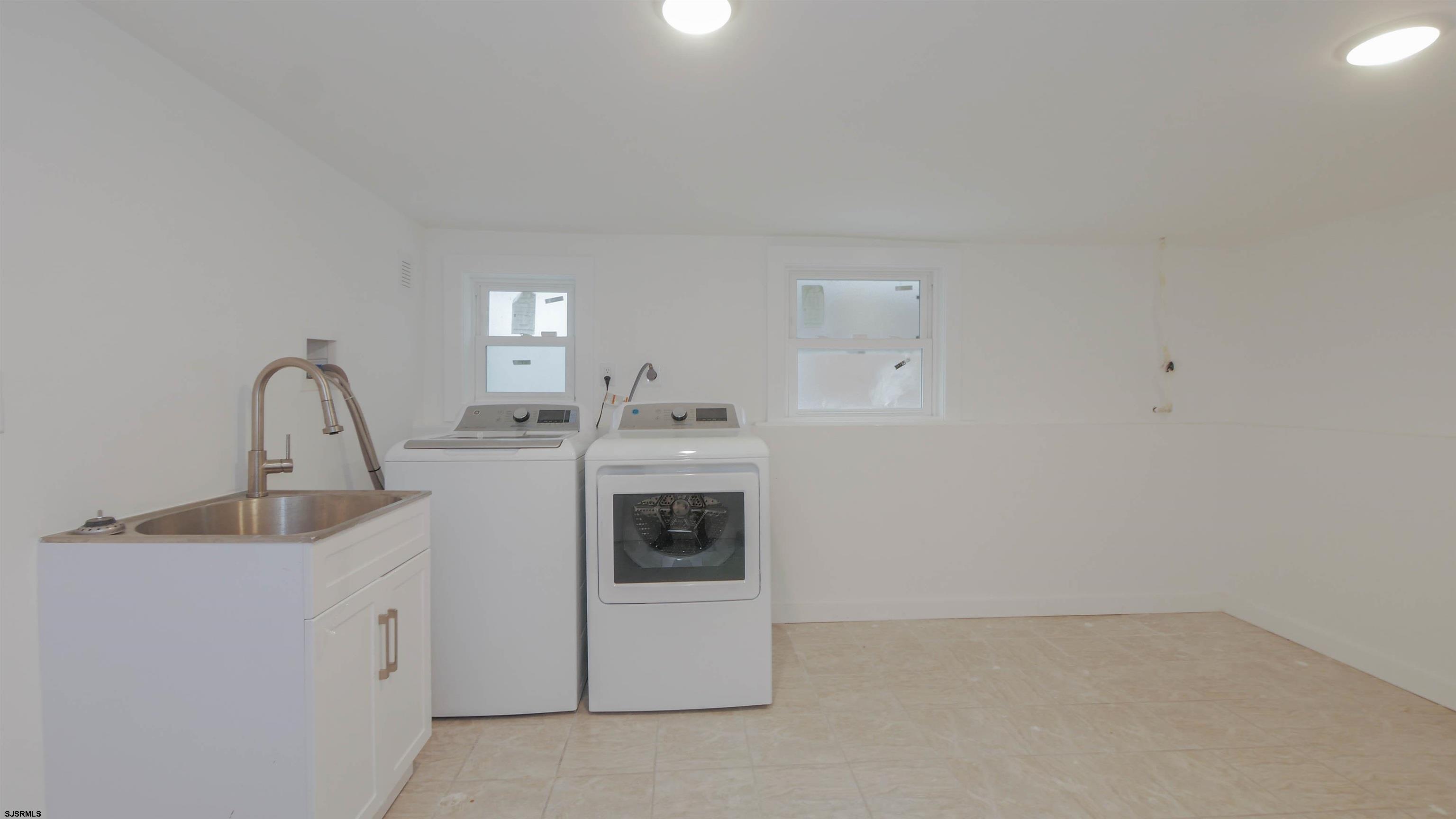 1 North Surrey Avenue, Unit CUSTOMIZE RENTAL Ventnor City, NJ 08406 - Photo 34 of 36 a kitchen with white cabinets and white appliances