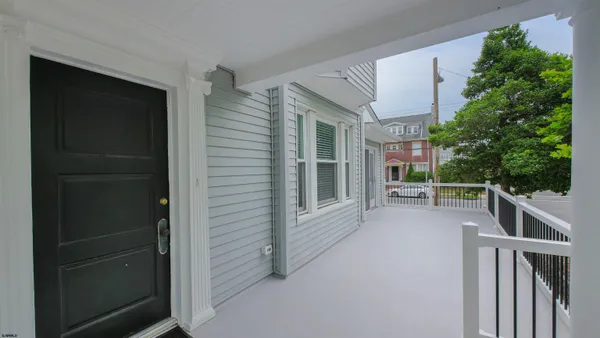 a view of balcony and yard