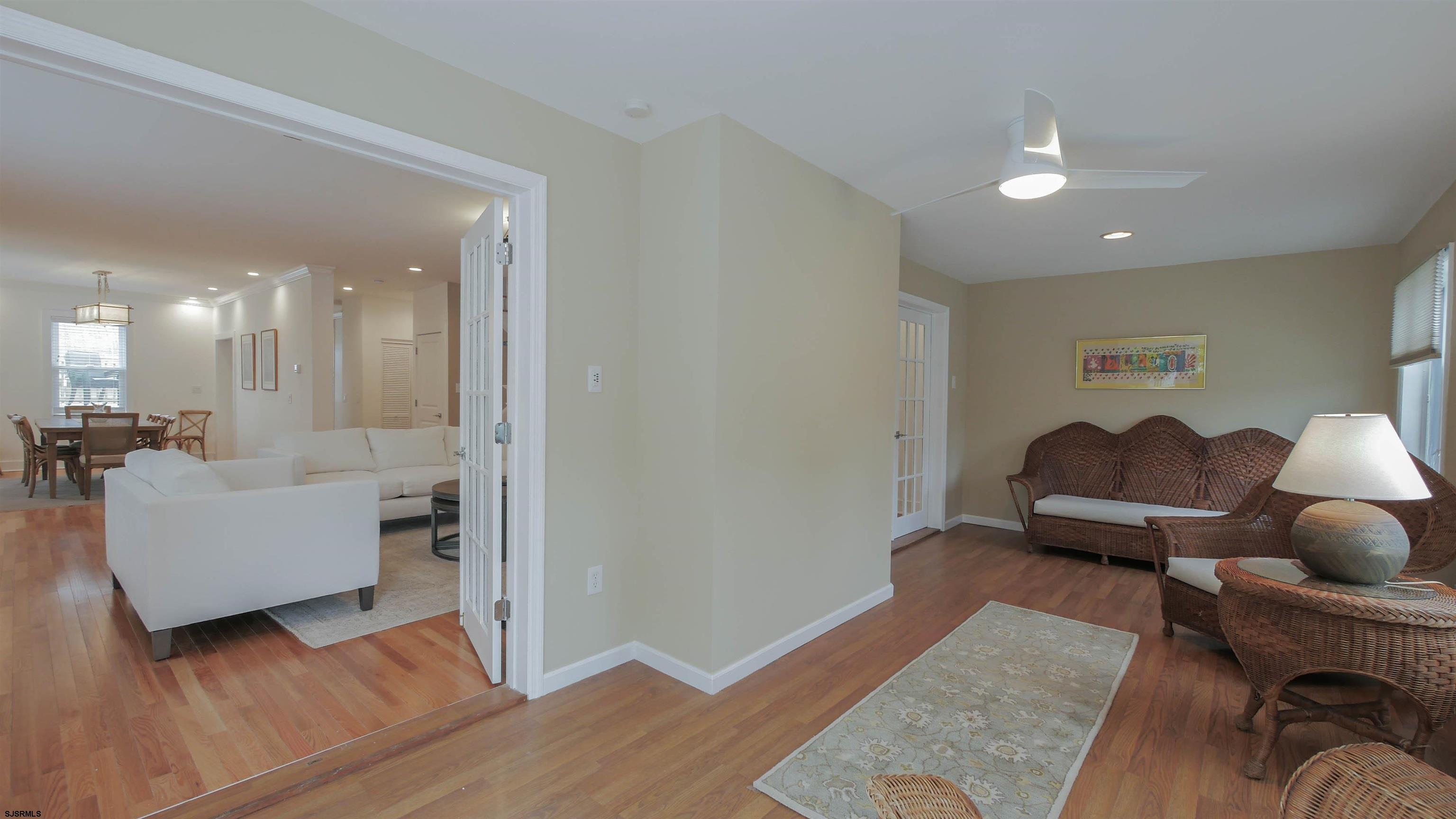 1 North Surrey Avenue, Unit CUSTOMIZE RENTAL Ventnor City, NJ 08406 - Photo 10 of 36 a living room with furniture and a wooden floor