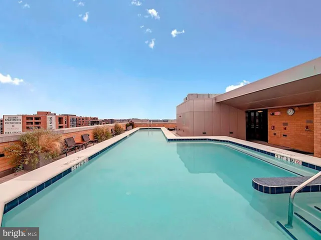 a view of swimming pool with a yard