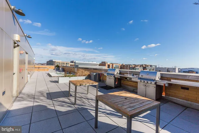 a view of a terrace with furniture and stove