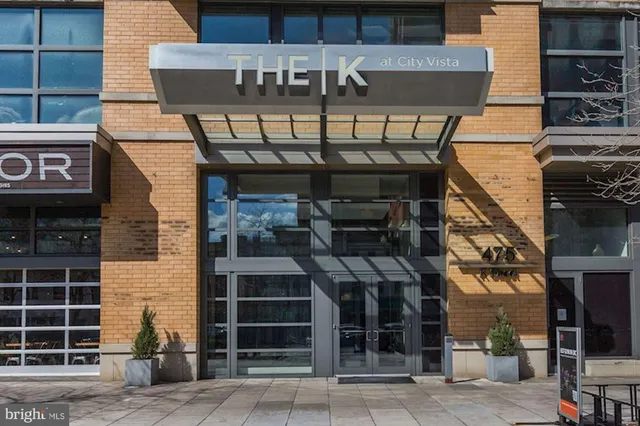 a front view of a building with parking space