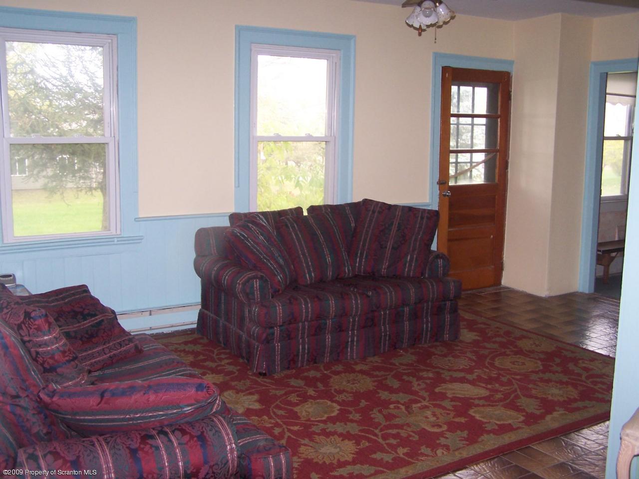 407 Gravity Road Lake Ariel, PA 18436 - Photo 11 of 27 a living room with furniture and a window