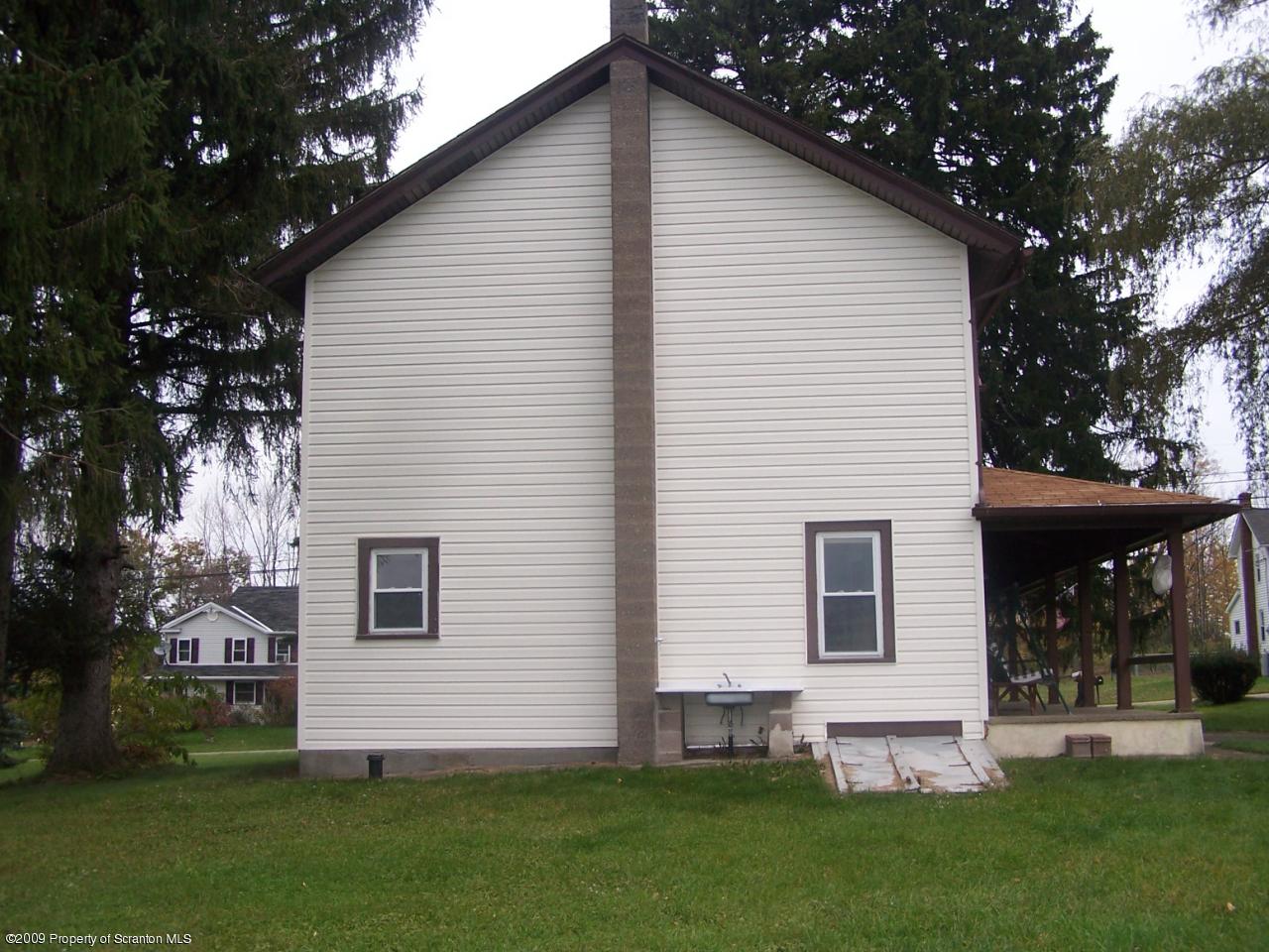 407 Gravity Road Lake Ariel, PA 18436 - Photo 22 of 27 a front view of a house with a garden