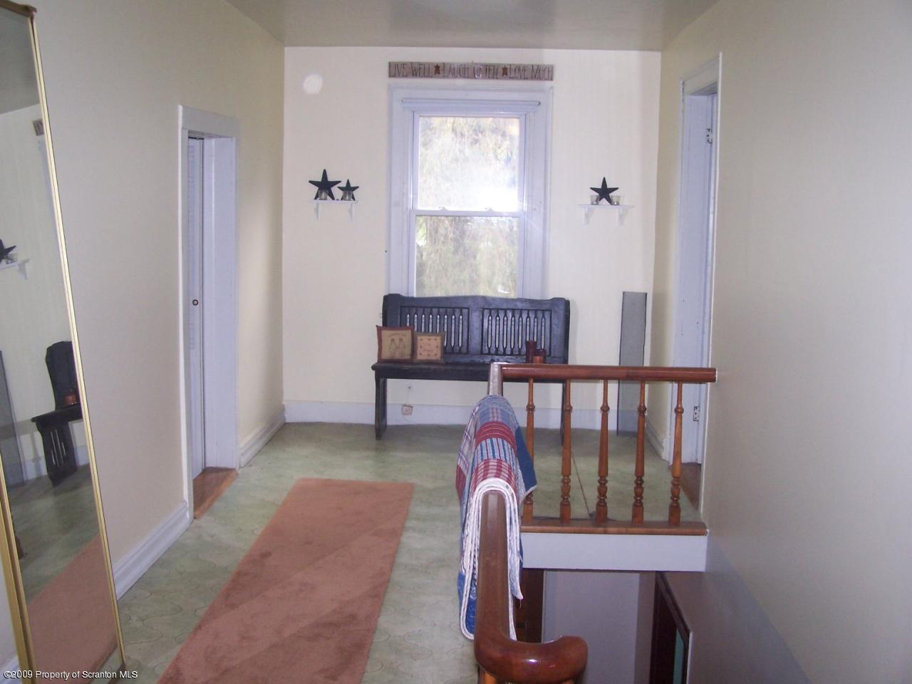 407 Gravity Road Lake Ariel, PA 18436 - Photo 24 of 27 a balcony with hardwood table and chairs