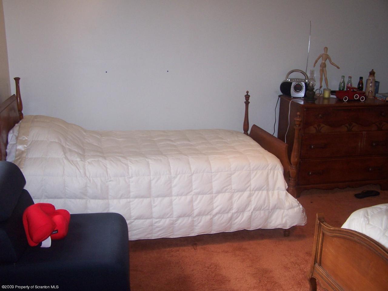 407 Gravity Road Lake Ariel, PA 18436 - Photo 7 of 27 a bedroom with a bed and a mirror