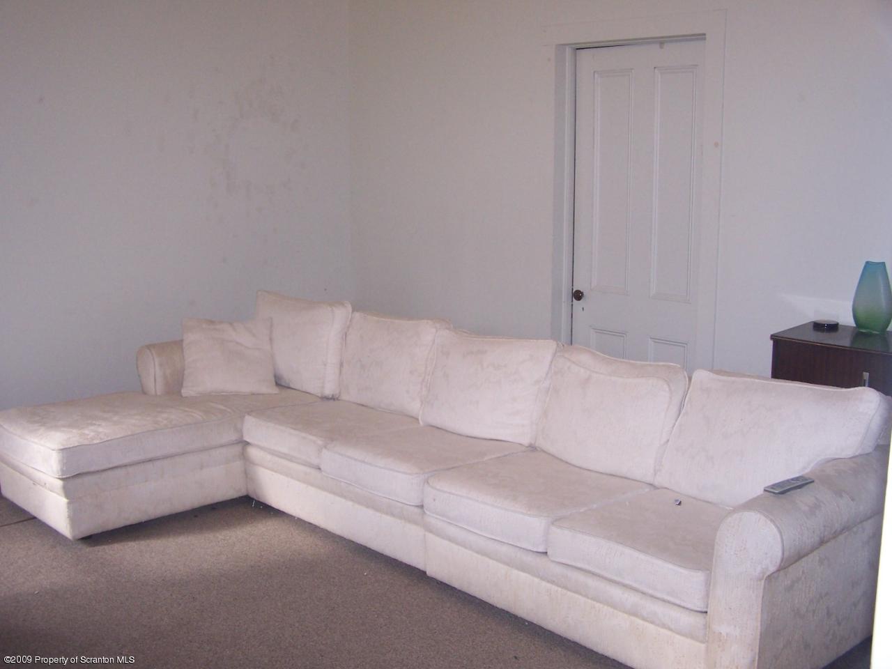 407 Gravity Road Lake Ariel, PA 18436 - Photo 8 of 27 a living room with furniture and a couch