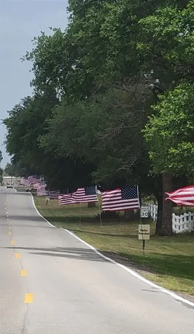 a view of swimming pool with a table and chairs