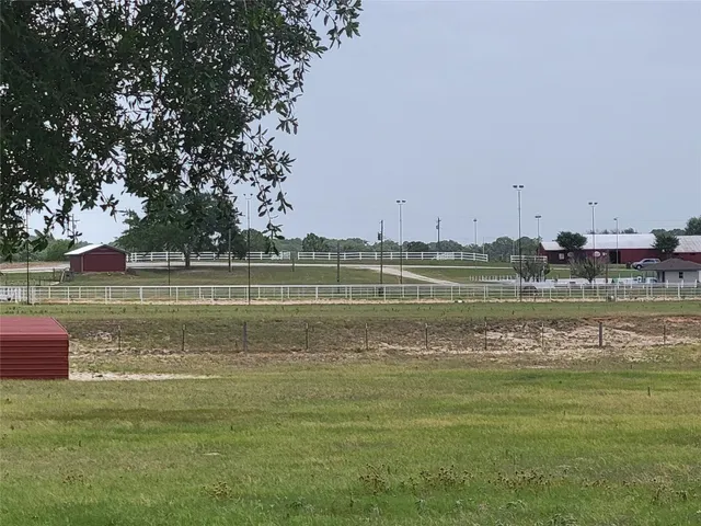 a view of a lake with houses and trees