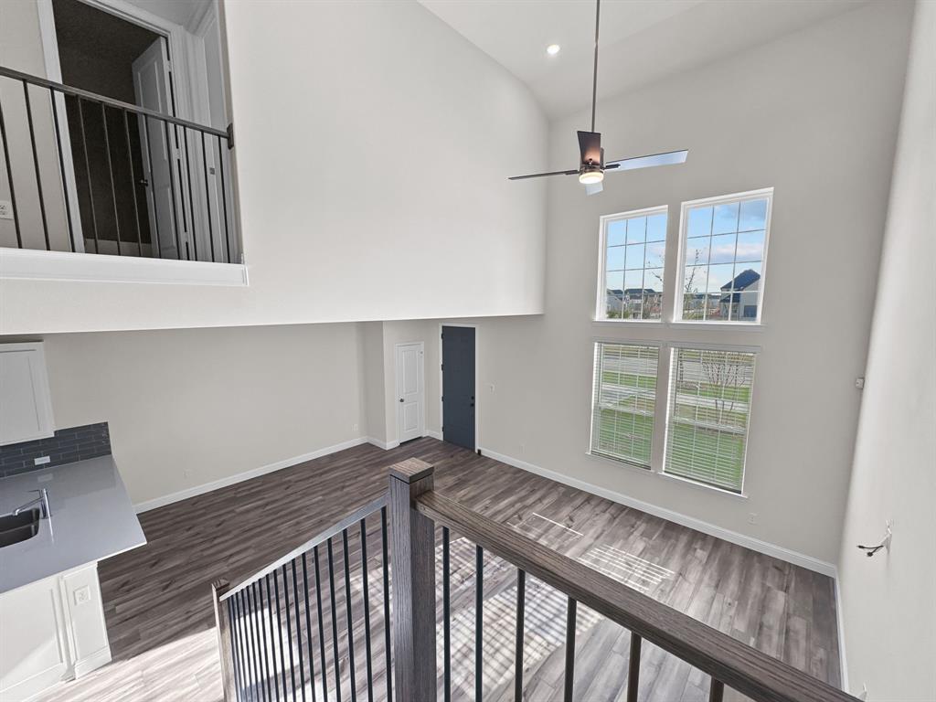 8876 Samara Street Frisco, TX 75035 - Photo 13 of 28 a view of a hallway with windows