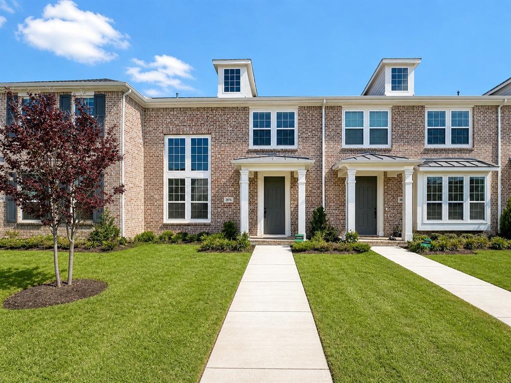 8876 Samara Street Frisco, TX 75035 - Photo 2 of 28 front view of a brick house with a yard