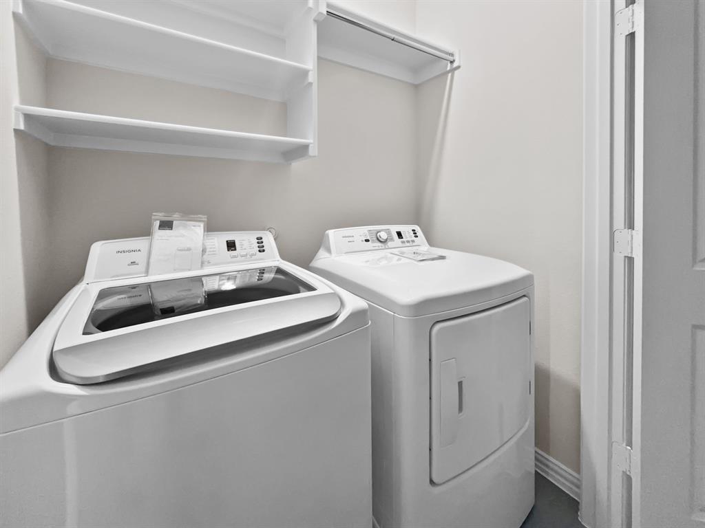 8876 Samara Street Frisco, TX 75035 - Photo 22 of 28 a utility room with dryer and washer