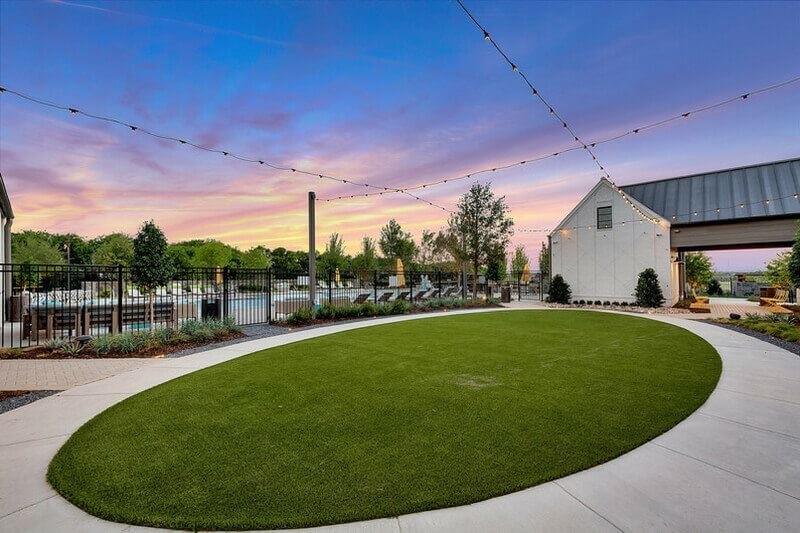 8876 Samara Street Frisco, TX 75035 - Photo 26 of 28 a view of a swimming pool with a outdoor seating