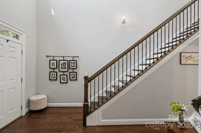 a dining room with stainless steel appliances kitchen island granite countertop a dining table and chairs