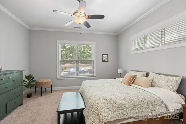 a en suite bathroom with double sink and a large mirror