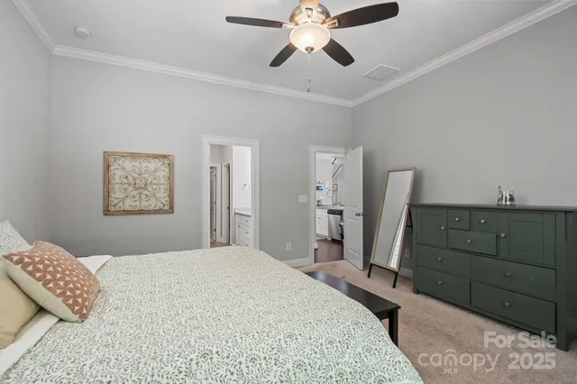 a bathroom with a granite countertop double vanity sink and a mirror