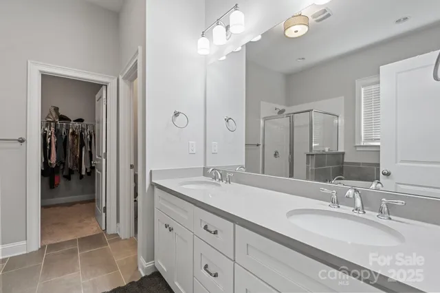 a bed sitting in a bedroom next to a desk