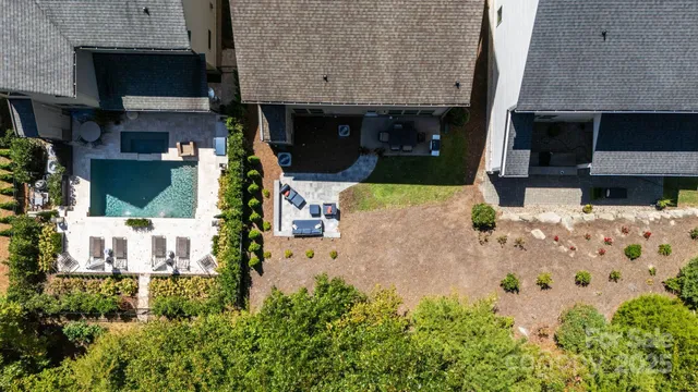 a view of a hallway with wooden floor and stairs