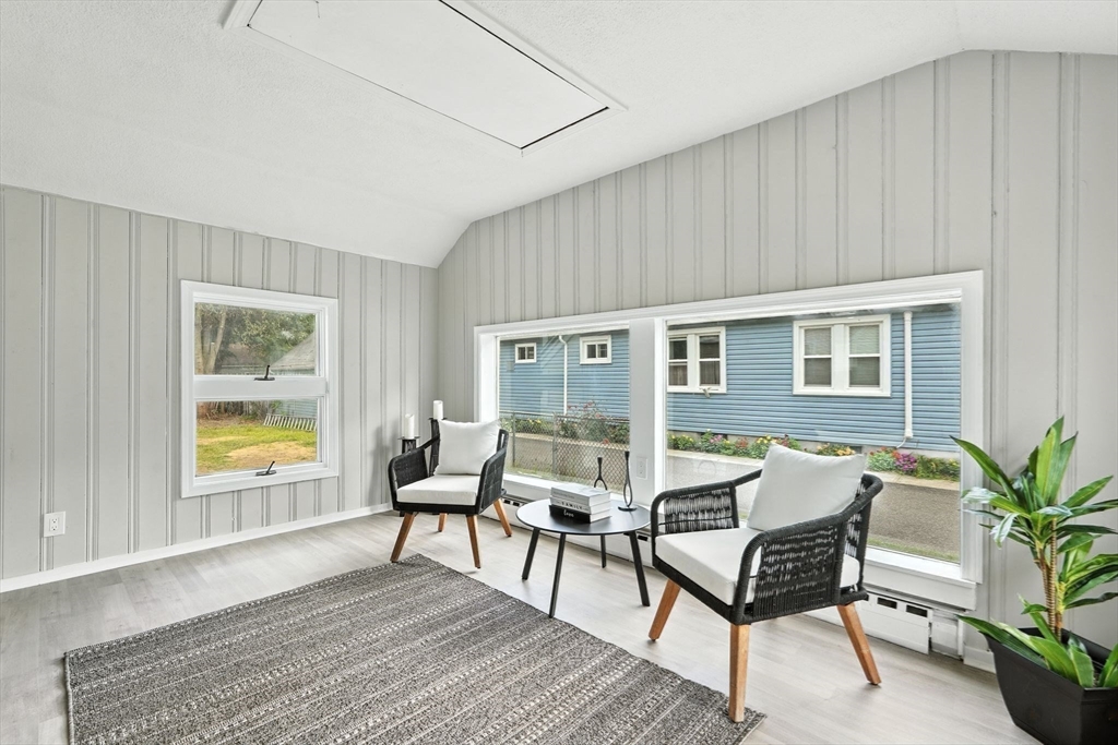77 Coleman Street Springfield, MA 01109 - Photo 12 of 24 a living room with furniture and a potted plant