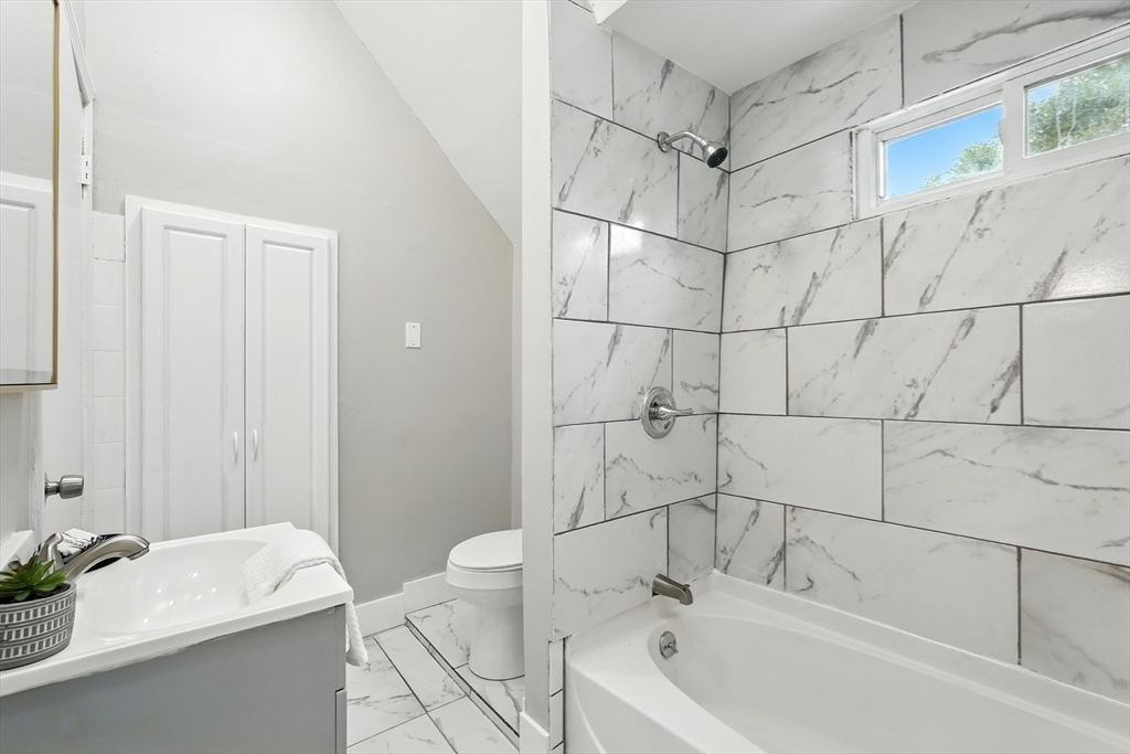 77 Coleman Street Springfield, MA 01109 - Photo 19 of 24 a bathroom with a sink a toilet and shower