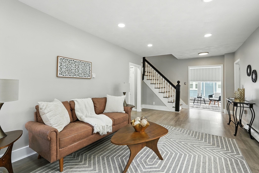 77 Coleman Street Springfield, MA 01109 - Photo 2 of 24 a living room with furniture and a wooden floor