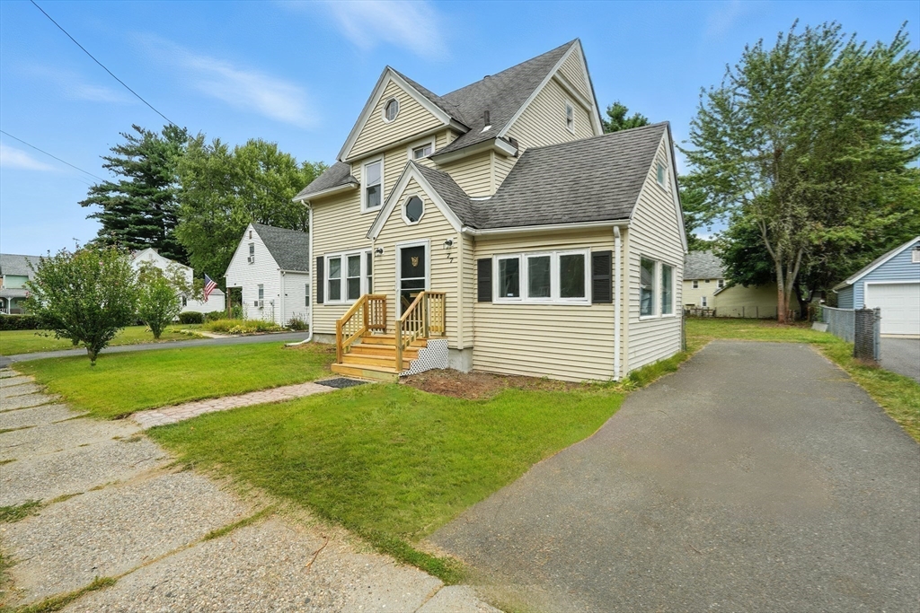 77 Coleman Street Springfield, MA 01109 - Photo 23 of 24 a front view of a house with yard and green space