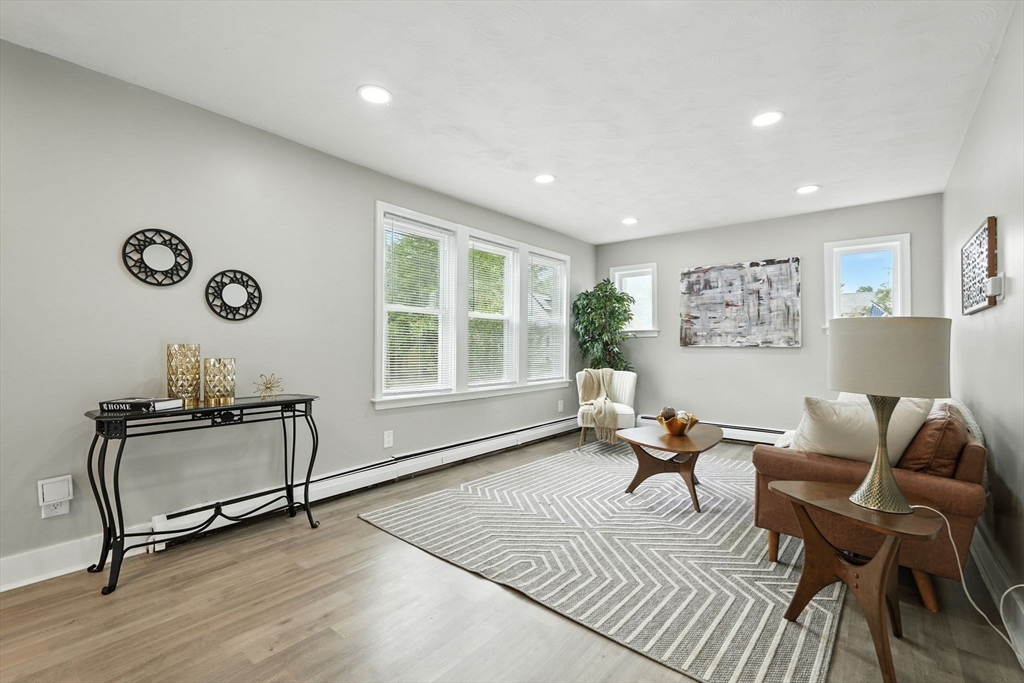 77 Coleman Street Springfield, MA 01109 - Photo 5 of 24 a living room with furniture and a window