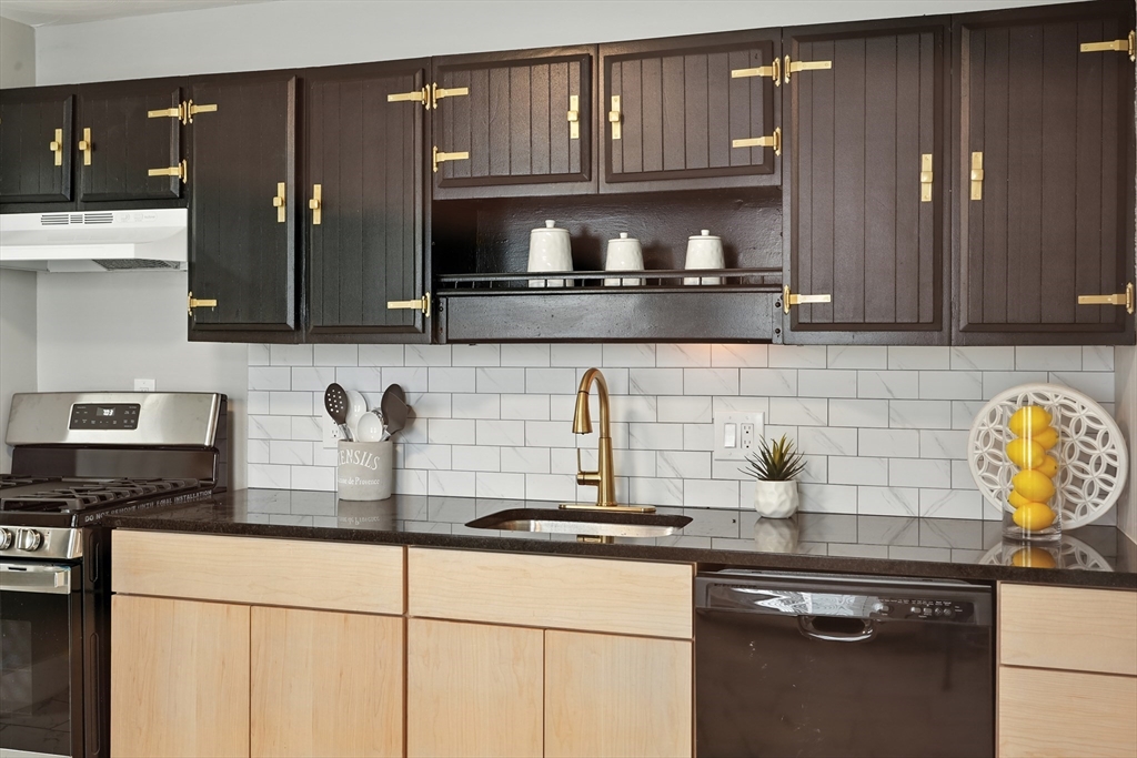 77 Coleman Street Springfield, MA 01109 - Photo 7 of 24 a kitchen with a sink and cabinets
