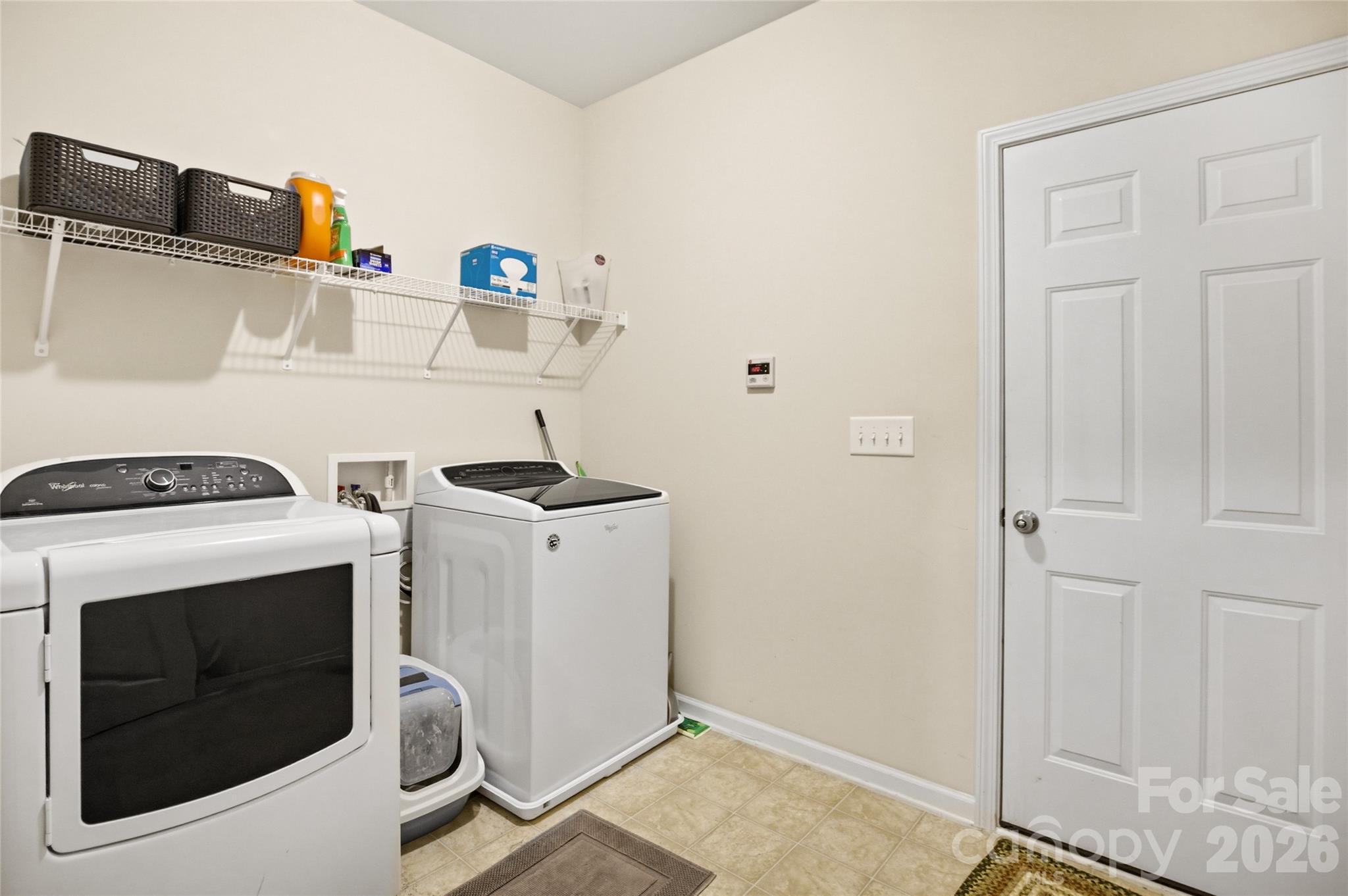 11824 Springpoint Lane Charlotte, NC 28278 - Photo 12 of 26 a utility room with dryer and washer