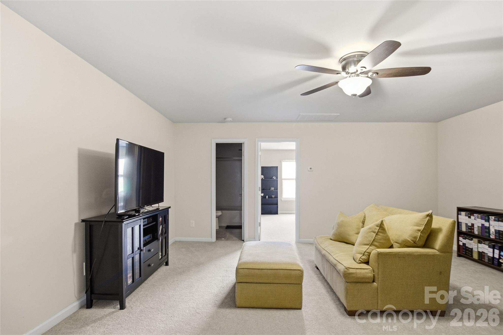 11824 Springpoint Lane Charlotte, NC 28278 - Photo 18 of 26 a living room with furniture and a flat screen tv