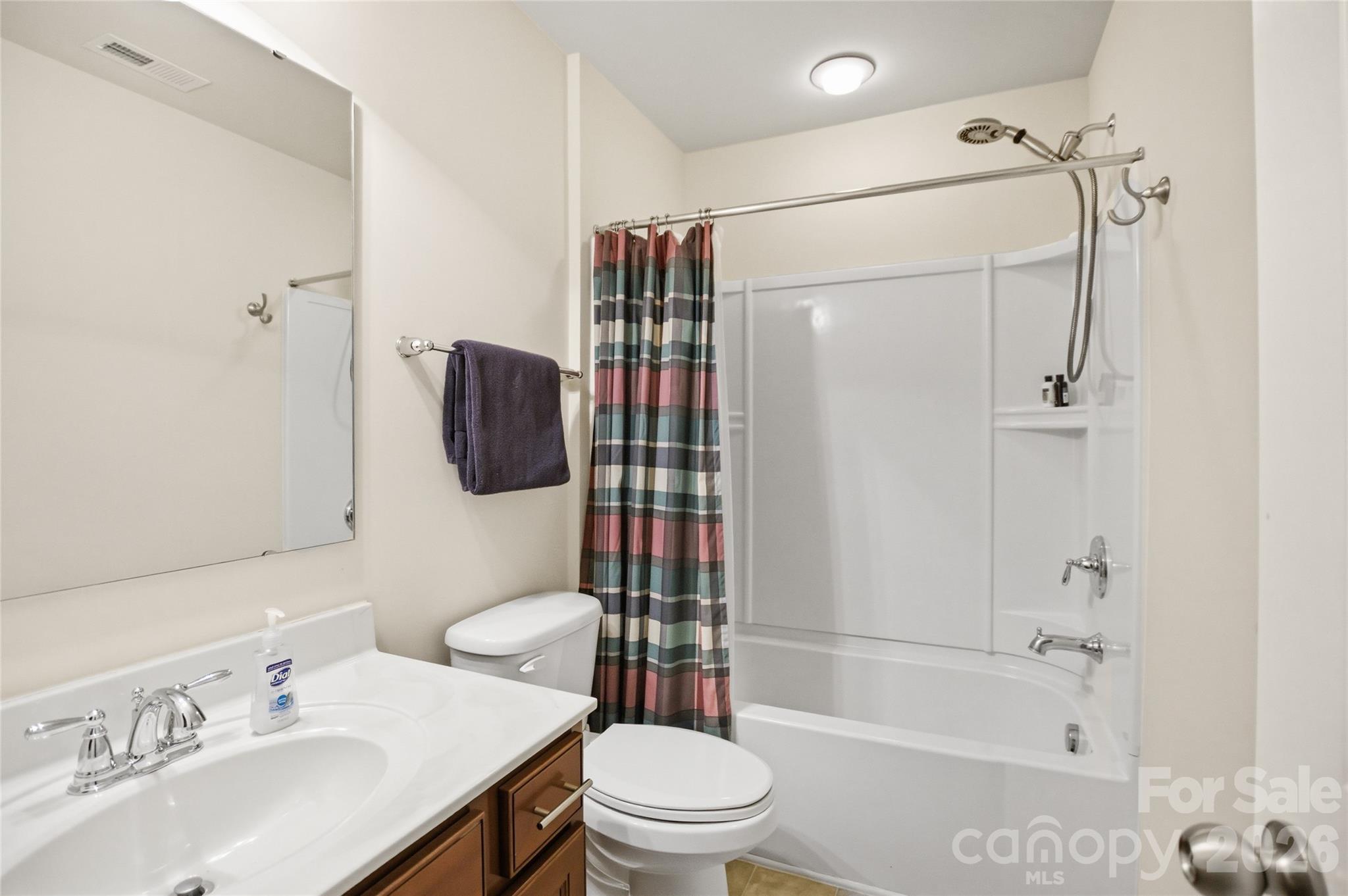11824 Springpoint Lane Charlotte, NC 28278 - Photo 19 of 26 a bathroom with a sink toilet and shower