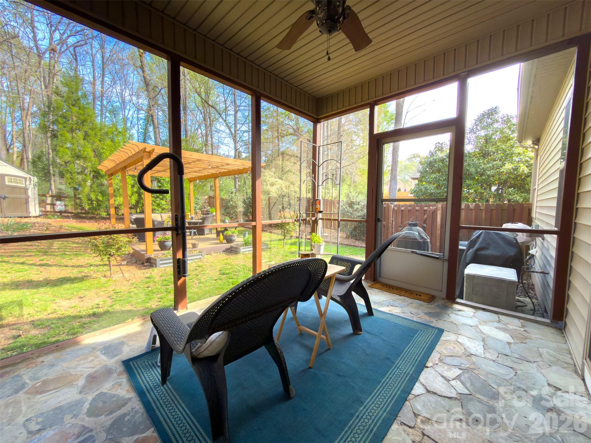 11824 Springpoint Lane Charlotte, NC 28278 - Photo 22 of 26 a living room with furniture and floor to ceiling windows
