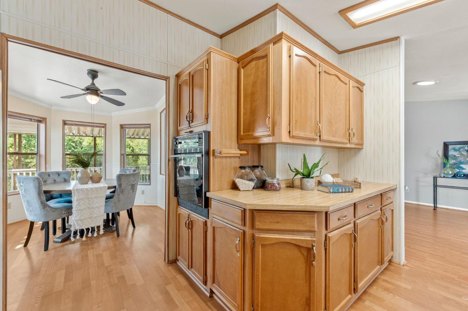 4390 Patterson Drive, Unit 218 Diamond Springs, CA 95619 - Photo 15 of 45 a view of a kitchen area with furniture and wooden floor