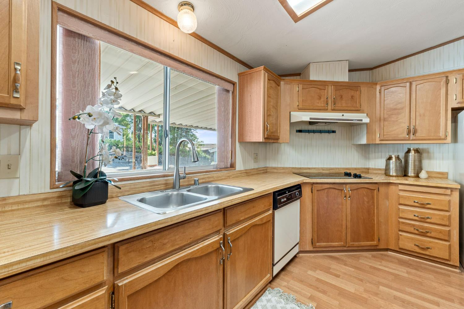 4390 Patterson Drive, Unit 218 Diamond Springs, CA 95619 - Photo 17 of 45 a kitchen with a sink and cabinets