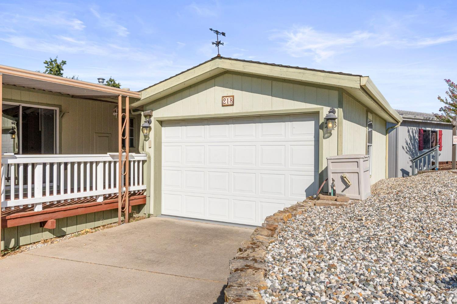 4390 Patterson Drive, Unit 218 Diamond Springs, CA 95619 - Photo 2 of 45 a front view of a house with a garage