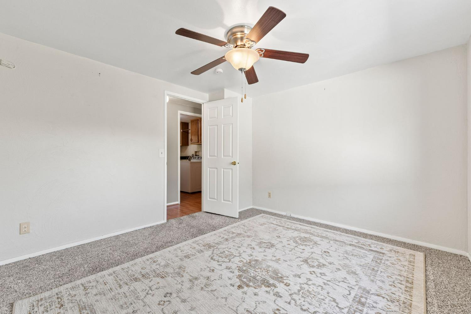 4390 Patterson Drive, Unit 218 Diamond Springs, CA 95619 - Photo 25 of 45 wooden floor in an empty room