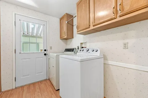 a utility room with a sink dryer and washer